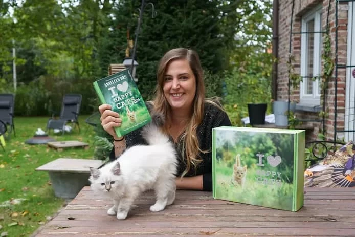 Felinova with a book and a cat