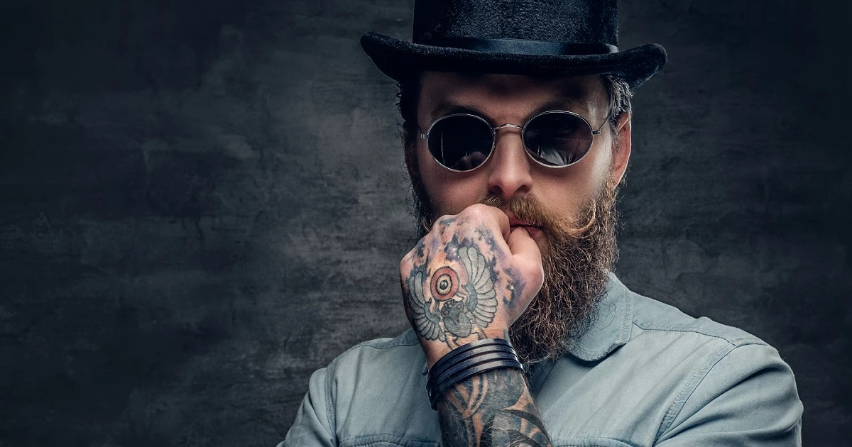 man holding beard and pos terminal